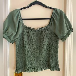 Olive green ruffle top with puffed sleeves